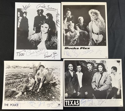 Lot 486 - A group of band signed promotional photographs...