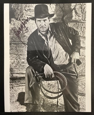 Lot 462 - HARRISON FORD - An autographed 8" x 10" black...