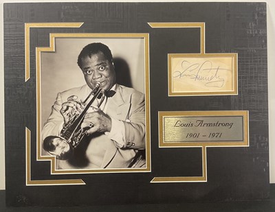 Lot 487 - A display of LOUIS ARMSTRONG containing his...