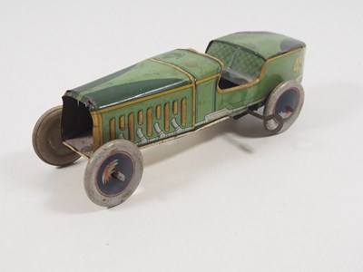 Lot 106 - An ALFRED WELLS clockwork tinplate open race...