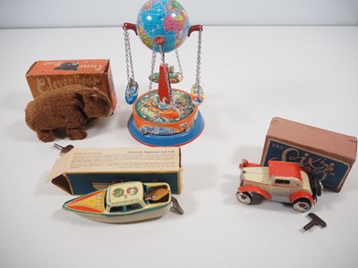 Lot 111 - A group of tinplate / clockwork toys of German...