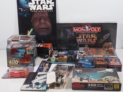 Lot 133 - A group of STAR WARS related toys and...