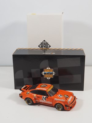 Lot 272 - A pair of EXOTO 1:18 scale Porsche race cars,...