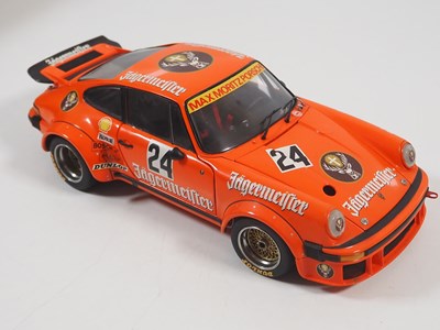 Lot 272 - A pair of EXOTO 1:18 scale Porsche race cars,...