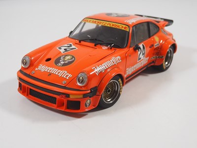 Lot 272 - A pair of EXOTO 1:18 scale Porsche race cars,...