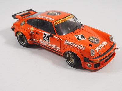 Lot 272 - A pair of EXOTO 1:18 scale Porsche race cars,...