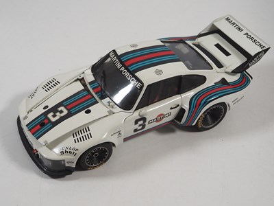 Lot 272 - A pair of EXOTO 1:18 scale Porsche race cars,...