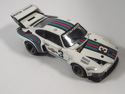 Lot 272 - A pair of EXOTO 1:18 scale Porsche race cars,...