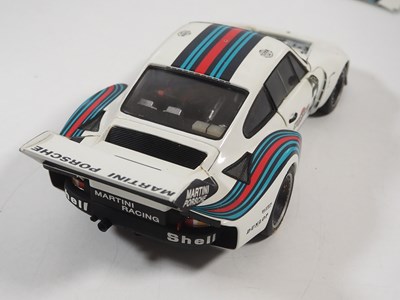 Lot 272 - A pair of EXOTO 1:18 scale Porsche race cars,...