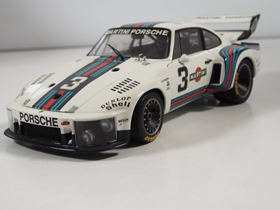 Lot 272 - A pair of EXOTO 1:18 scale Porsche race cars,...