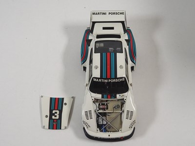 Lot 272 - A pair of EXOTO 1:18 scale Porsche race cars,...