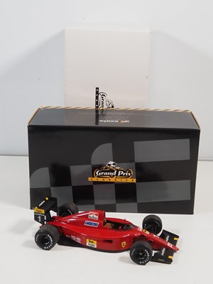 Lot 274 - A pair of EXOTO 1:18 scale Formula 1 race cars...