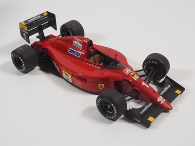 Lot 274 - A pair of EXOTO 1:18 scale Formula 1 race cars...