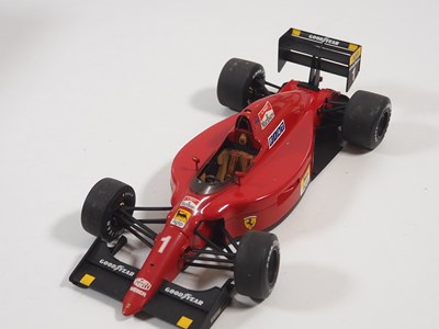 Lot 274 - A pair of EXOTO 1:18 scale Formula 1 race cars...