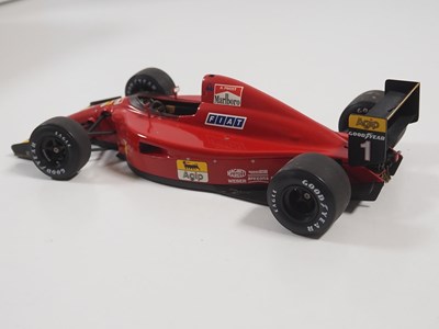 Lot 274 - A pair of EXOTO 1:18 scale Formula 1 race cars...
