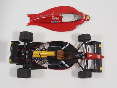 Lot 274 - A pair of EXOTO 1:18 scale Formula 1 race cars...