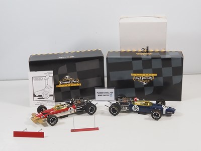 Lot 275 - A pair of EXOTO 1:18 scale Lotus Ford Formula...