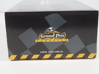 Lot 275 - A pair of EXOTO 1:18 scale Lotus Ford Formula...
