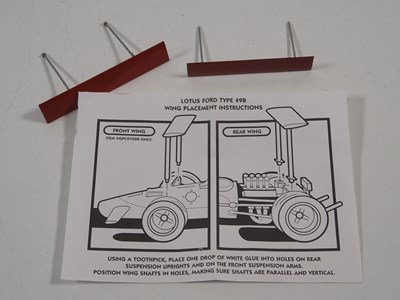 Lot 275 - A pair of EXOTO 1:18 scale Lotus Ford Formula...