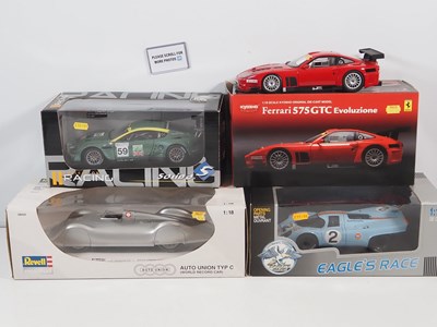 Lot 286 - A group of four 1:18 scale racing cars by...