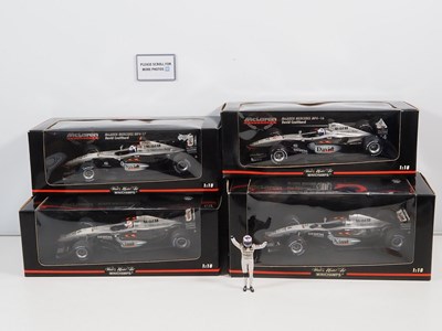 Lot 287 - A group of four MINICHAMPS 1:18 scale McLaren...