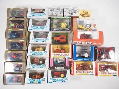 Lot 462 - A group of boxed diecast tractors by ERTL,...