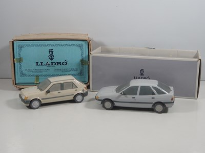 Lot 550 - A pair of LLADRO porcelain promotional car...