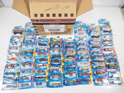 Lot 554 - A HOTWHEELS trade box of carded cars, as new,...