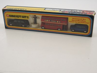 Lot 591 - A CORGI gift set #11 comprising a London Taxi,...