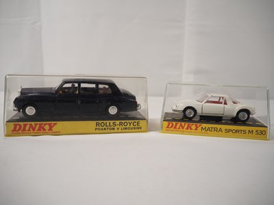 Lot 97 - A pair of vintage DINKY diecast cars...