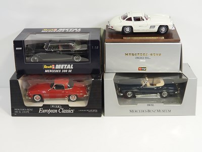 Lot 232 - A group of 1:18 scale diecast cars by REVELL,...