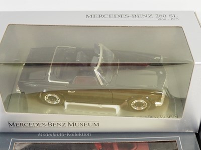 Lot 234 - A group of 1:18 scale diecast cars by REVELL,...
