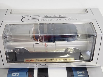 Lot 234 - A group of 1:18 scale diecast cars by REVELL,...