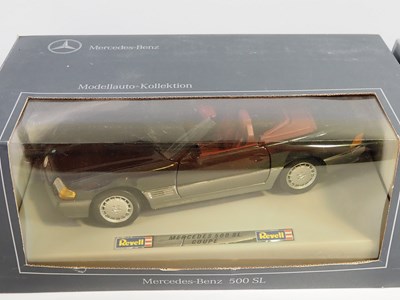 Lot 234 - A group of 1:18 scale diecast cars by REVELL,...