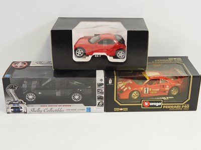 Lot 238 - A group of 1:18 scale diecast cars by KYOSHO,...