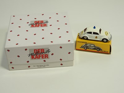 Lot 276 - A pair of 1:43 scale diecast VW Beetles...