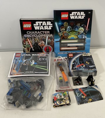 Lot 684 - STAR WARS: A group of LEGO Star Wars items to...