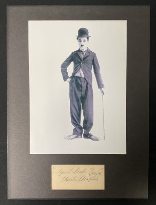 Lot 573 - CHARLIE CHAPLIN - A signed card by the English...