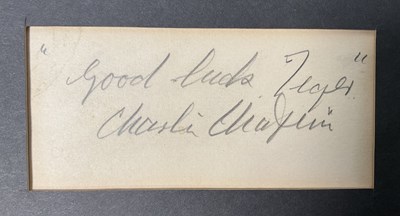 Lot 573 - CHARLIE CHAPLIN - A signed card by the English...