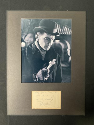 Lot 549 - PETER CUSHING - An autographed piece of paper...