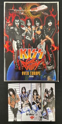 Lot 509 - A KISS 2010 Sonic Boom tour photo card signed...