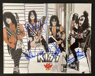 Lot 509 - A KISS 2010 Sonic Boom tour photo card signed...