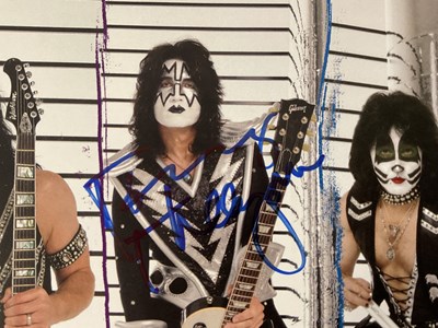 Lot 509 - A KISS 2010 Sonic Boom tour photo card signed...