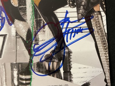 Lot 509 - A KISS 2010 Sonic Boom tour photo card signed...