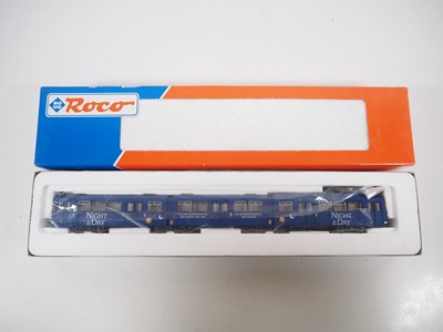 Lot 23 - A pair of ROCO HO gauge 3-car Duwag tram cars...