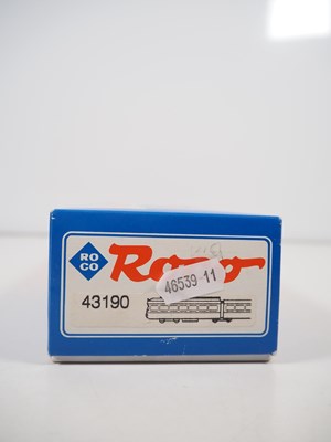 Lot 23 - A pair of ROCO HO gauge 3-car Duwag tram cars...