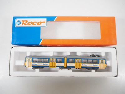 Lot 24 - A pair of ROCO HO gauge Duwag tram cars...