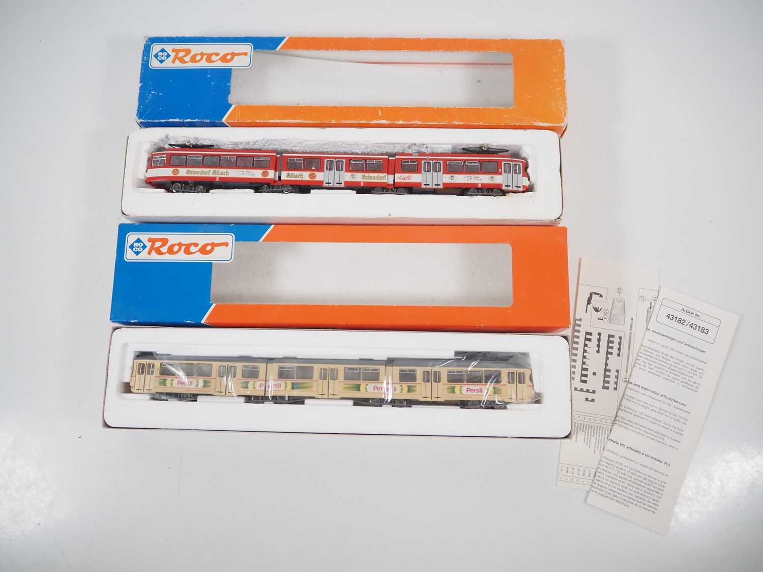Lot 25 - A pair of ROCO HO gauge 3-car Duwag tram cars...