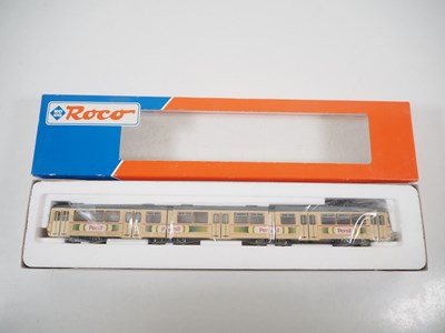 Lot 25 - A pair of ROCO HO gauge 3-car Duwag tram cars...