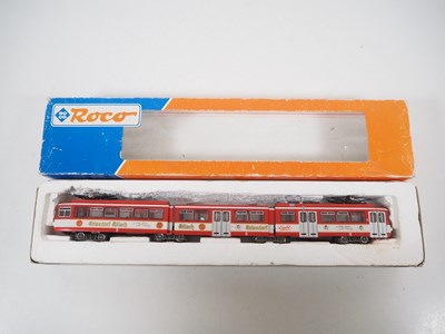 Lot 25 - A pair of ROCO HO gauge 3-car Duwag tram cars...